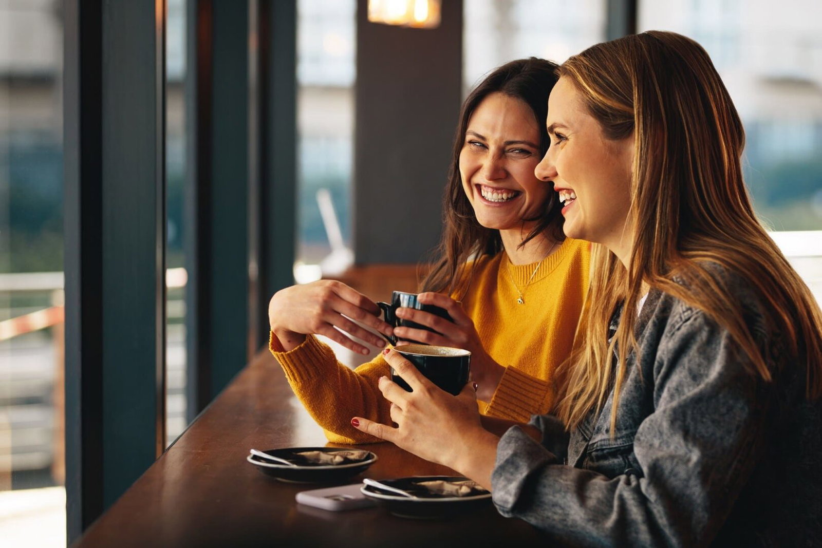 Women,Friends,Meeting,At,Cafe,On,A,Weekend.,Two,Female